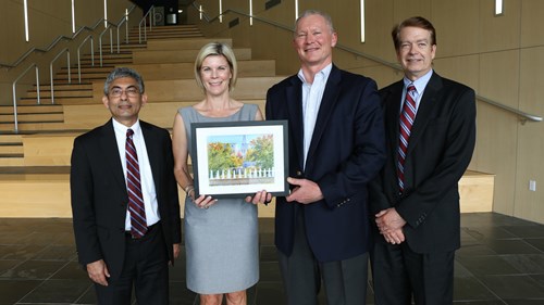 Borders is shown here with Dr. Mohammed Khayum, dean, Mr. Steve Mudd, and Dr. Brian McGuire, associate dean.