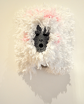 Mask with fluffy white material surrounding it