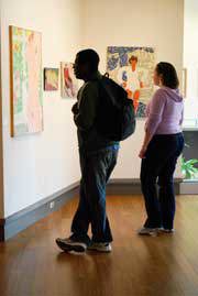 Students admiring the art of Stephen Pace.