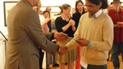 Dean Aakhus presents Perez with Best of Show award.