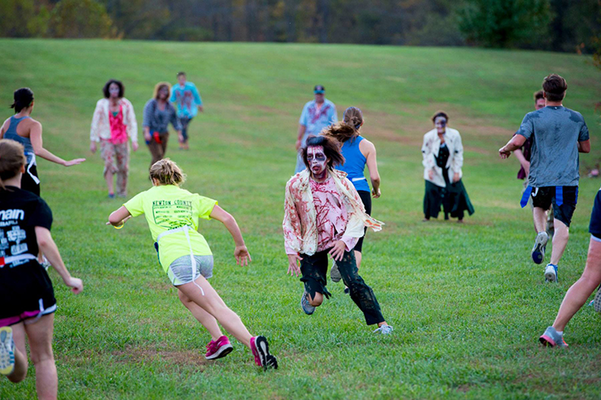 Runners dodge the zombies