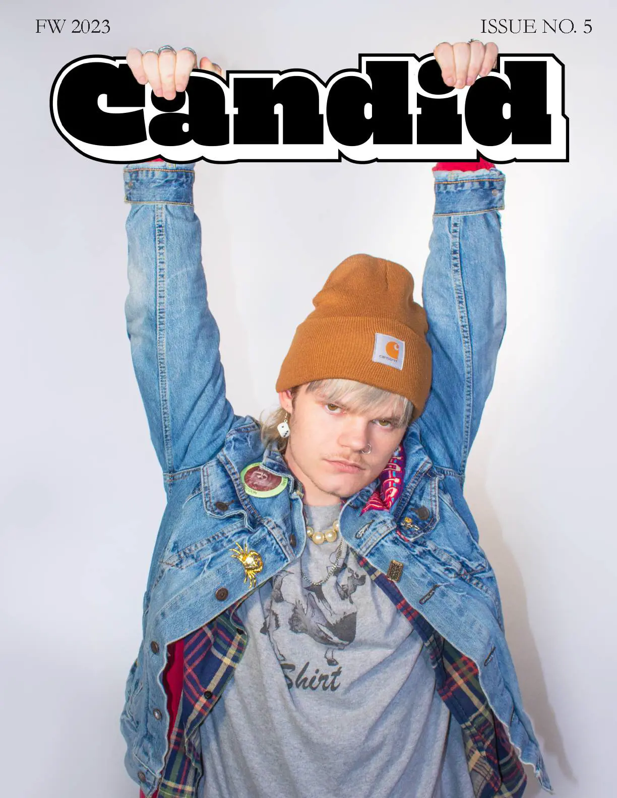 Candid Cover, photo of person with hands hooked over the logo.