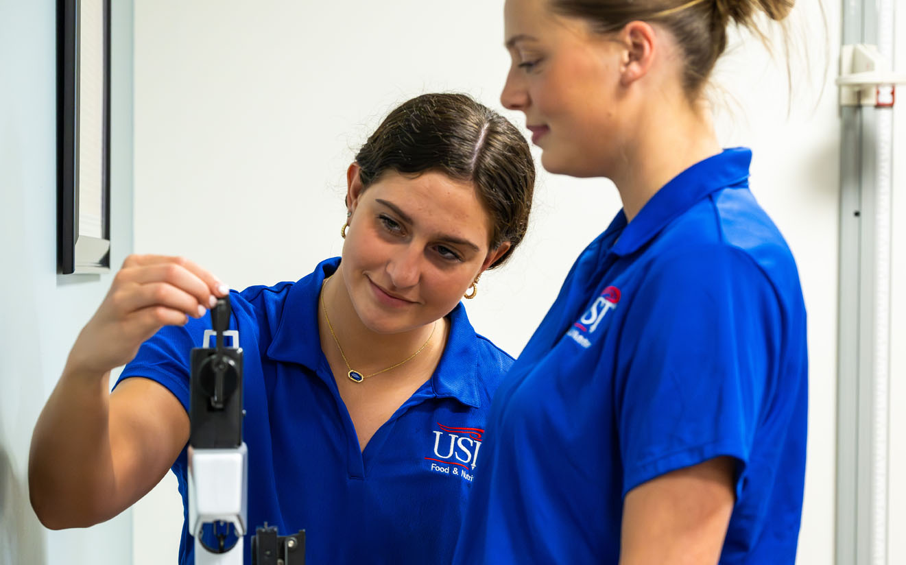Students Measure Body Weight On A Traditional Scale