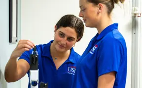 Students Measure Body Weight On A Traditional Scale