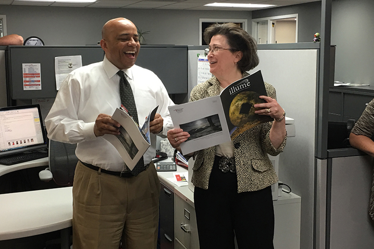 President Linda Bennett and Dr. Ron Rochon, provost, share a laugh over Rochon's look back in the day on page 13 of illume.