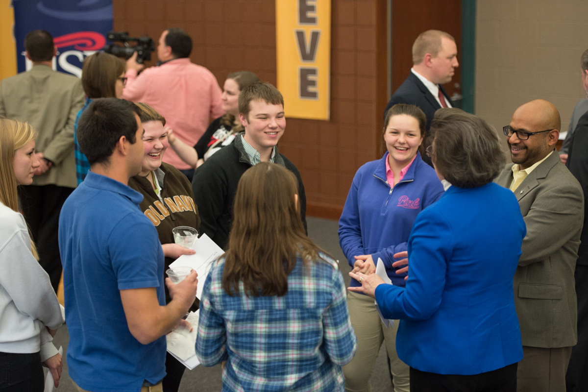 Dr. Kevin Valadares and Dr. Linda L. M. Bennett addressing senior students of the EVSC Medical Professions Academy at a press conference on December 14.