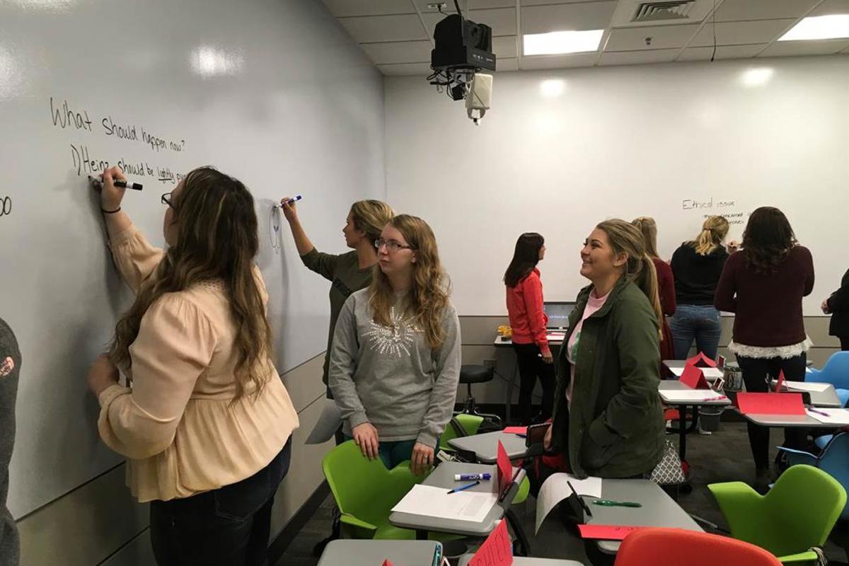 Students interact with the new whiteboard. 