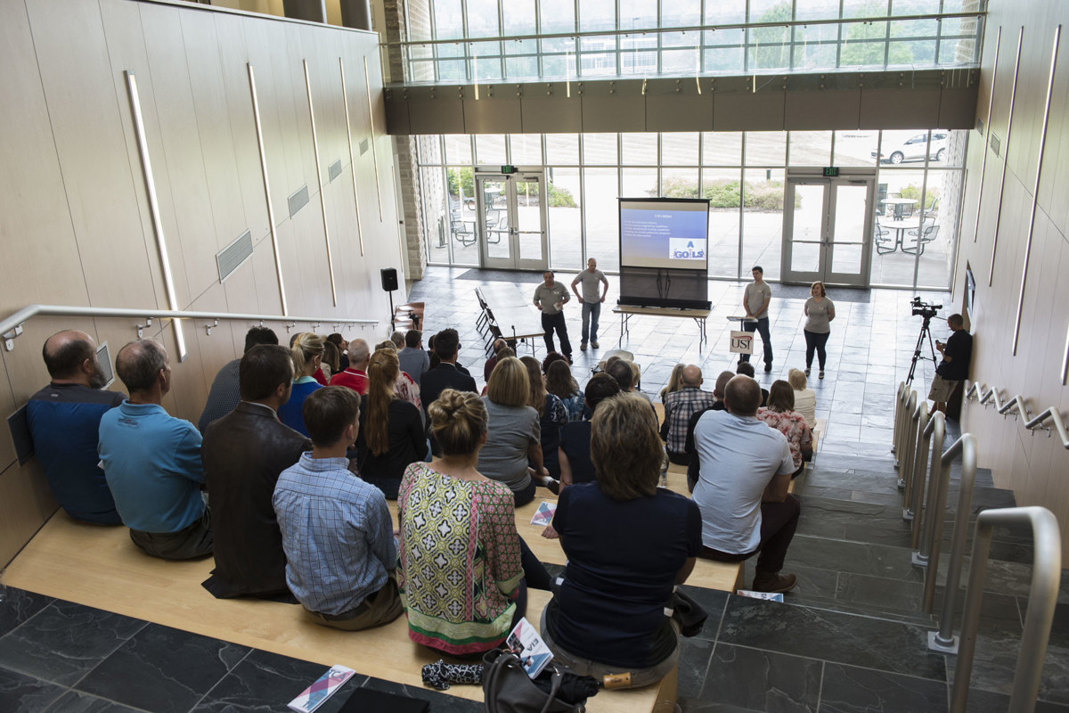 Audience members hear presentations from the Technology Commercialization Academy participants, a program developed in part through a partnership between USI and NSWC Crane