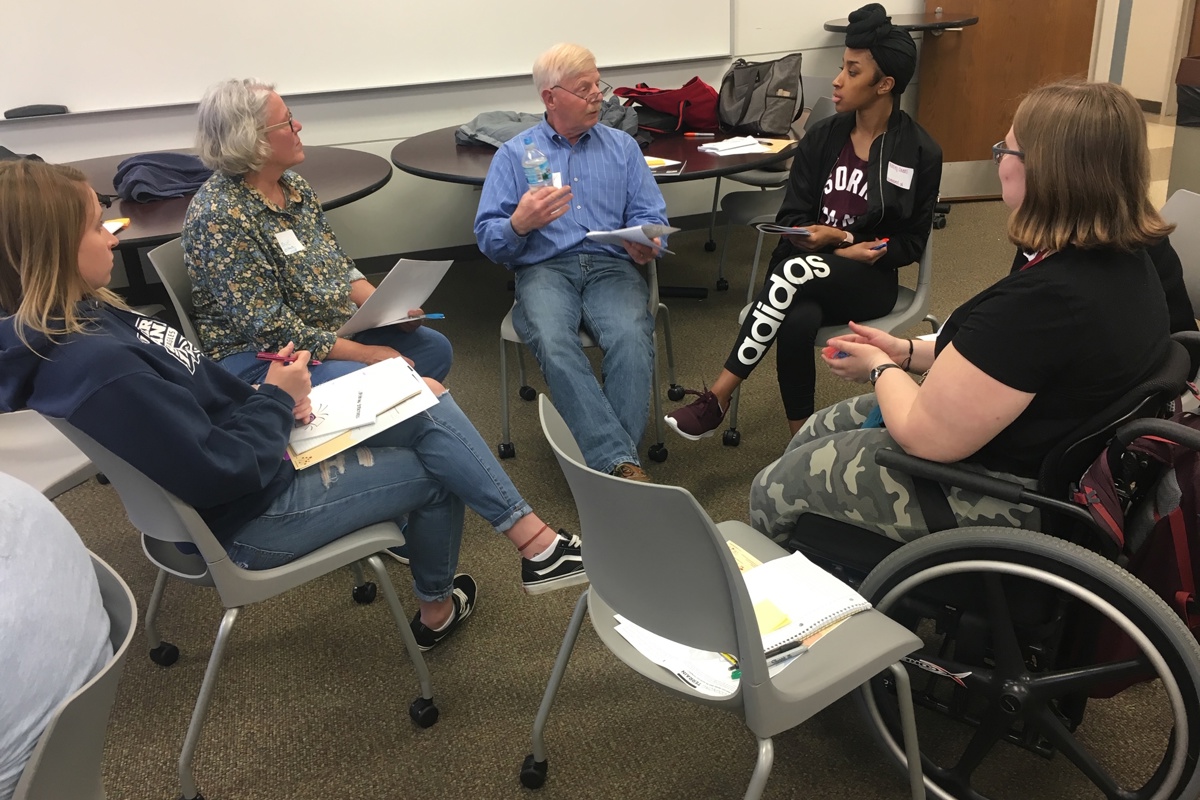 Participants in a recent MAGIC course at USI spend time in a small group discussion