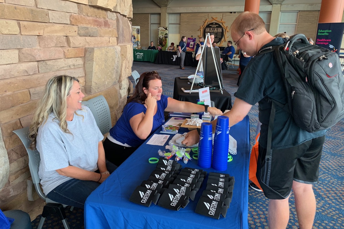 A student learns about a job opportunity at the Part-Time Job Fair hosted by USI Career Services and Internships. 