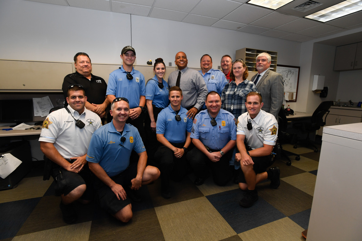 USI Public Safety officers pose with President Rochon and Steve Bridges, vice president for finance and administration.