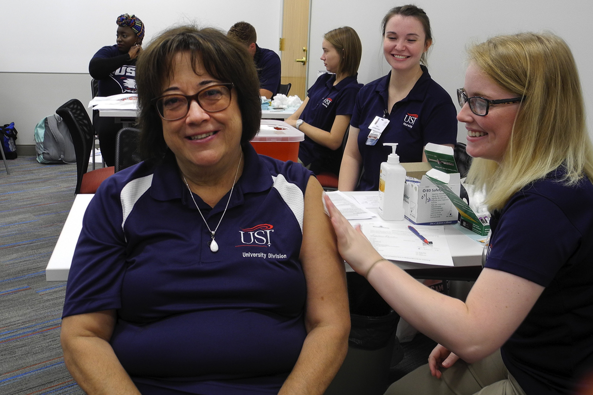 Suzanne Schroeder prepares to receive her annual flu shot