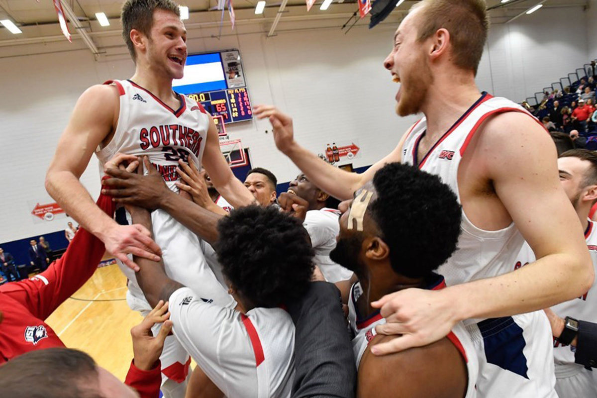 Alex Stein and his teammates celebrate a USI victory during the 2018-19 season.