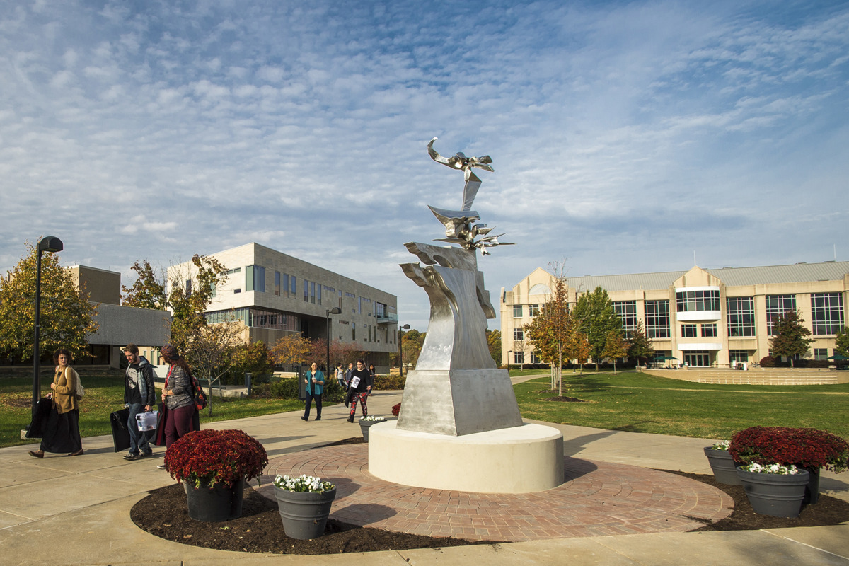 USI campus, including From Our Past Toward Our Future statue, the Liberal Arts Center and Business and Engineering Center