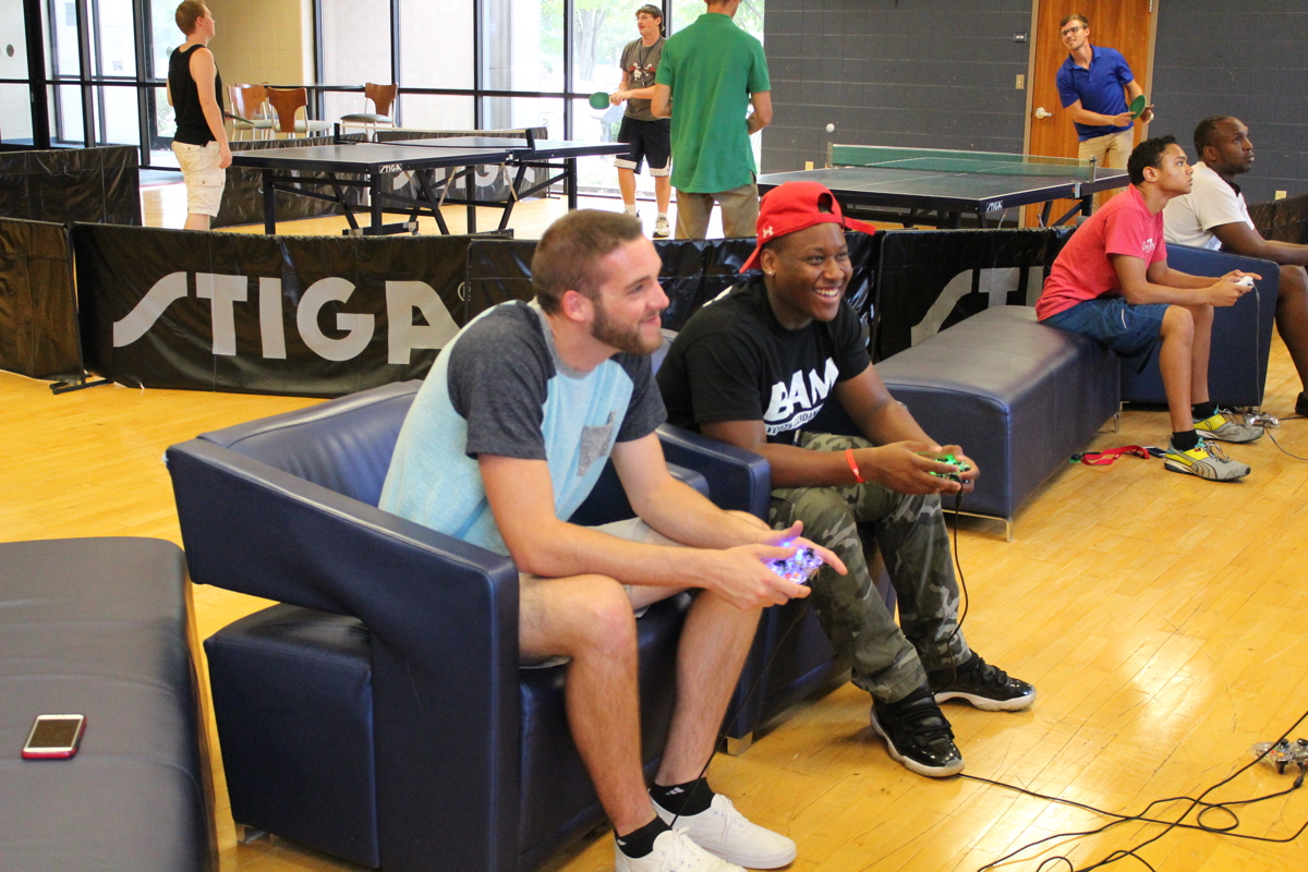 Two students play video games in the Recreation, Fitness and Wellness Center