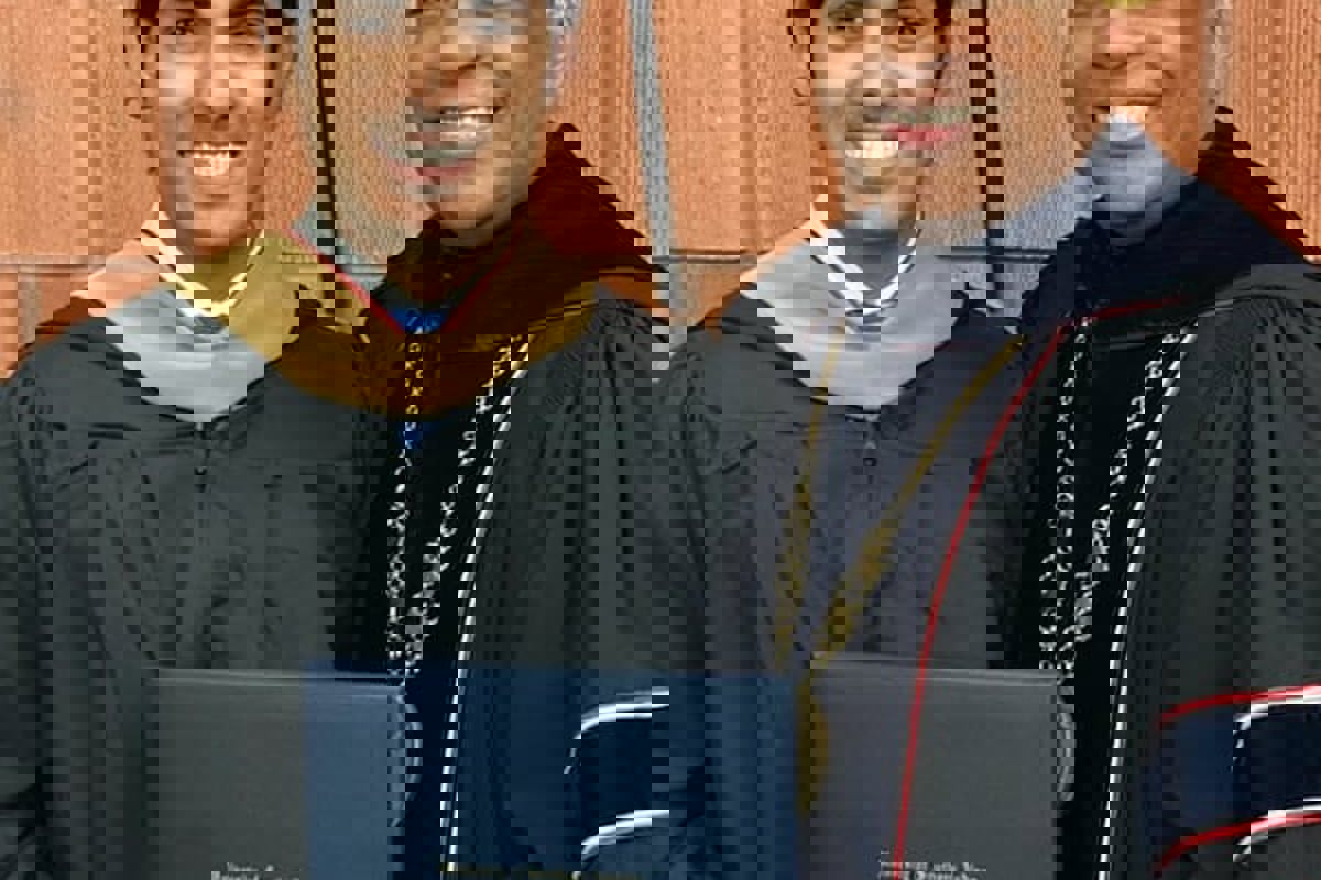 Talal Alanazi poses with USI president, Dr. Ronald Rochon, following fall 2019 Commencement