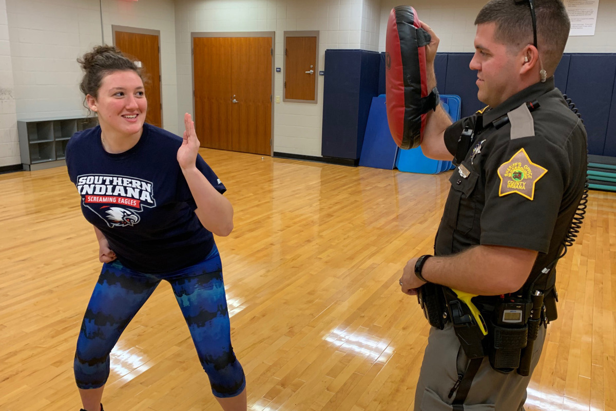 A R.A.D. Self-Defense Class participant and USI student demonstrates a self-defense technique with Deputy Clint Stanton, an instructor with the Vanderburgh County Sheriff's Office