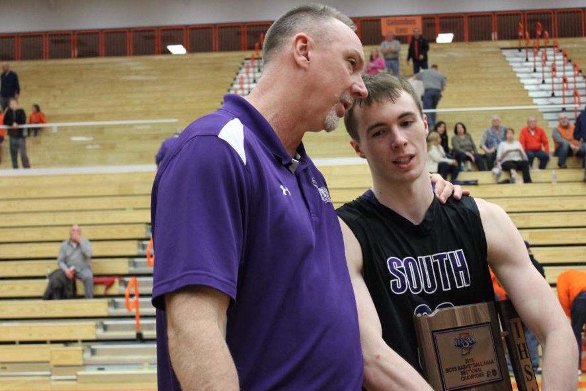 Neil and Chance Coyle after winning the sectional championship at Bloomington South High School in 2018