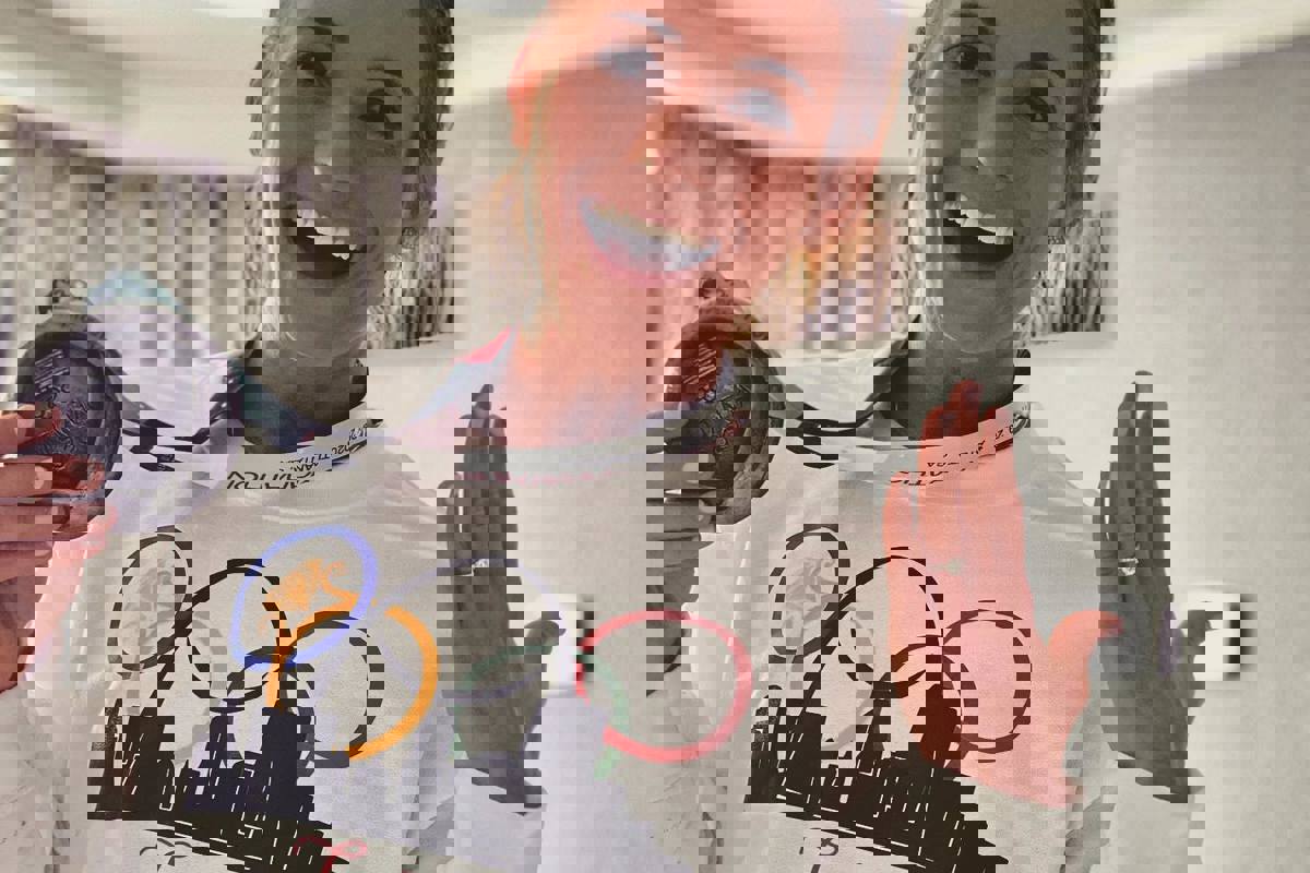 Julia Kohnen shows off her U.S. Olympic Marathon Trials 10th-place medal and engagement ring