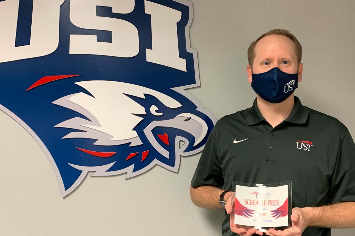 Mike Mikulski poses with his 2020 Screagle Pride Award