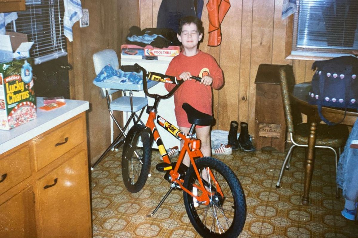 Dr. Zachary Ward poses with his new bike during Christmas 1991