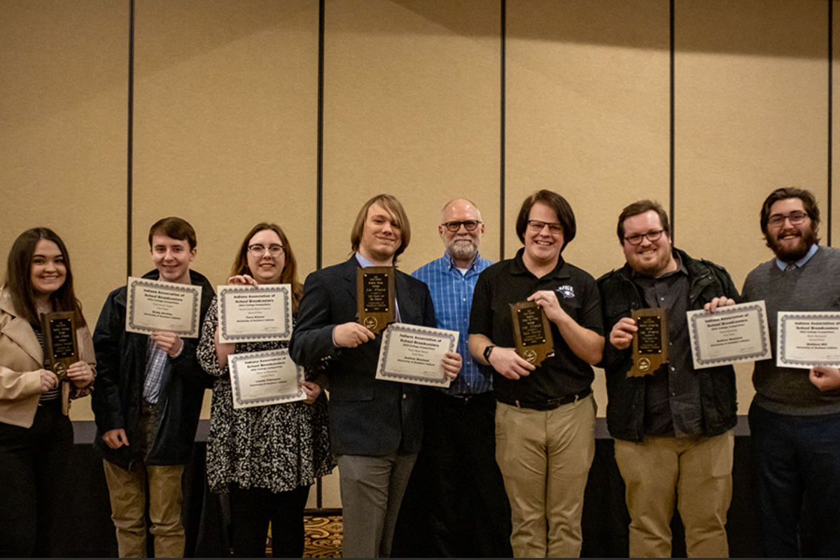 Student winners show off their new awards with Instructor of Radio and Television and General Manager at 95.7 The Spin John Morris.
