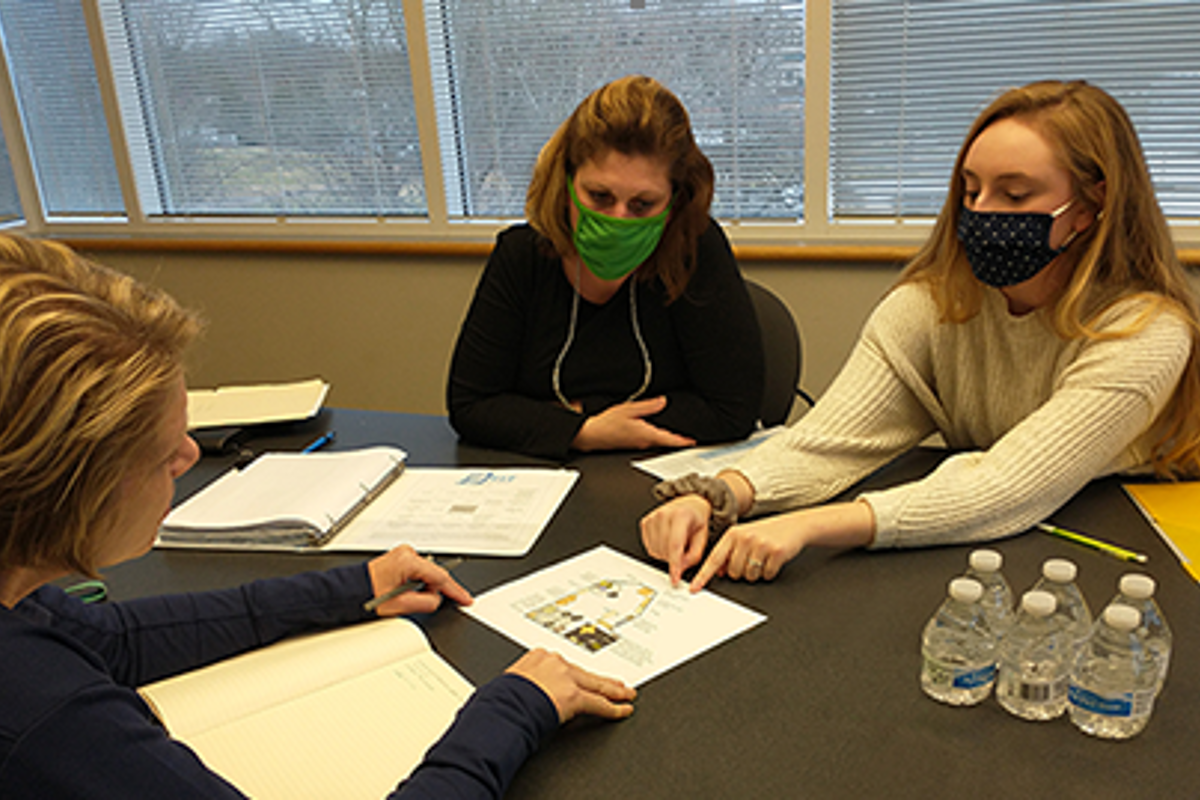 Dr. Jill Raisor and Sarah Barnes '22 present lesson plans to Jenny Chumbler, President of BFit by Bob's.