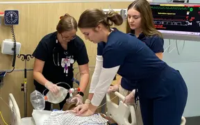 Respiratory Therapy students work together to revive a code blue practice patient