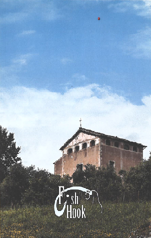 a picture of an old church surrounded by trees with a large expanse of sky with one small solitary red balloon floating away