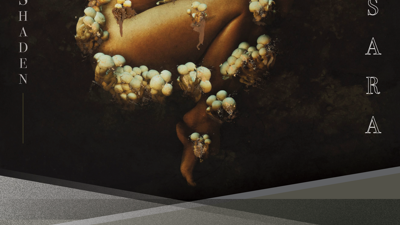 Exhibition poster featuring Brooke Shaden artwork of woman curled up like a fetus and covered in mushrooms