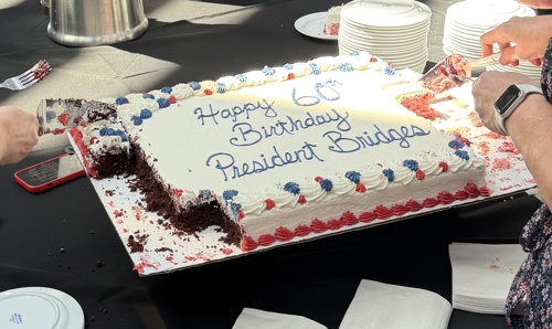 Cake that says "Happy Birthday president Bridges"