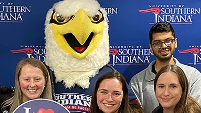 Photo of students with Archie the Eagle