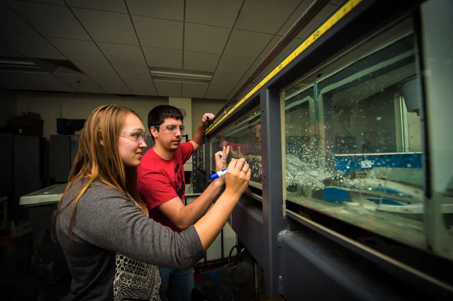 Engineering students work together to complete a project in the engineering lab