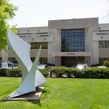 Large abstract sculpture on the lawn in front of the Orr Center building