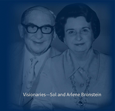 Portrait of the Bronsteins that says "Visionaires: Sol and Arlene Bronstein"