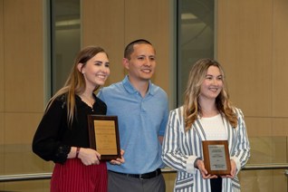 Tori, Brett and another student with their awards