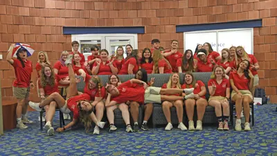 USI Amigos student group gather in the University Center for a silly group photo