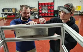 Students work on a project together in the Applied Engineering Center