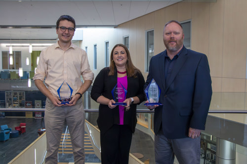 Nicolas, Cindi, Mark holding their award