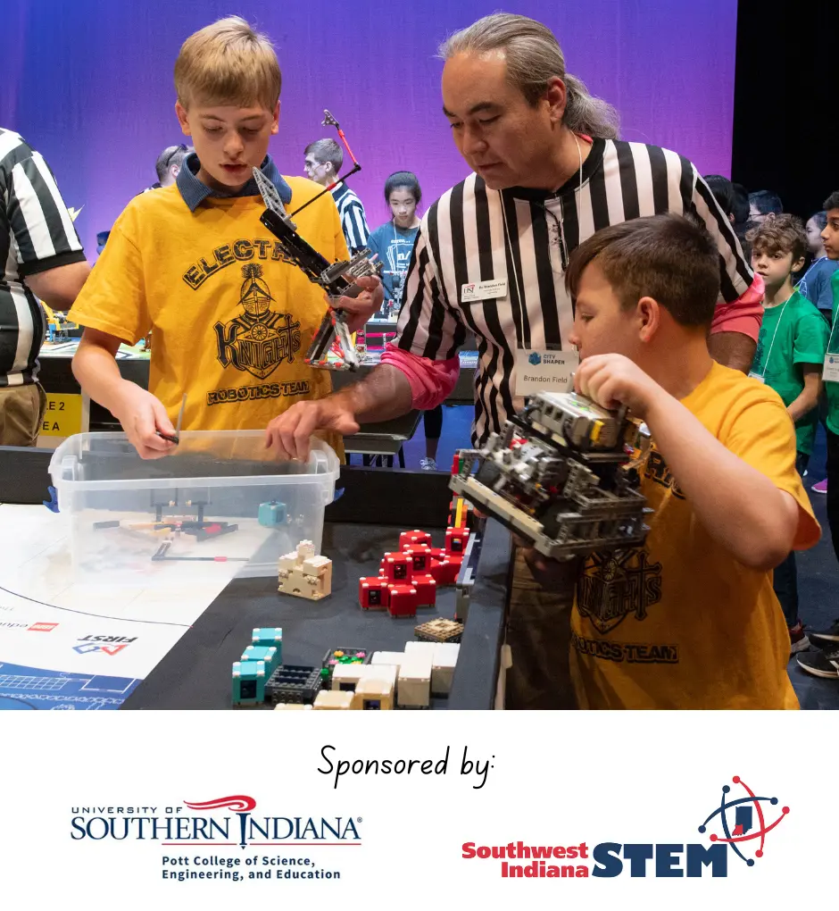 Competitors of the USI FIRST LEGO League Challenge discuss their robot game scores with a referee. 