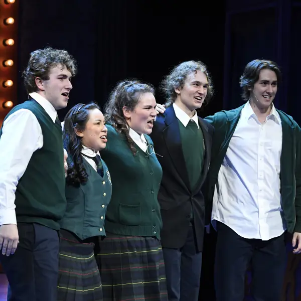 Student actors play a scene from a production of Almost Maine