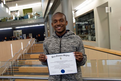 Miles holding BGS certificate