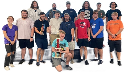 Group photo of student winners of the history department trivia contest with trophy