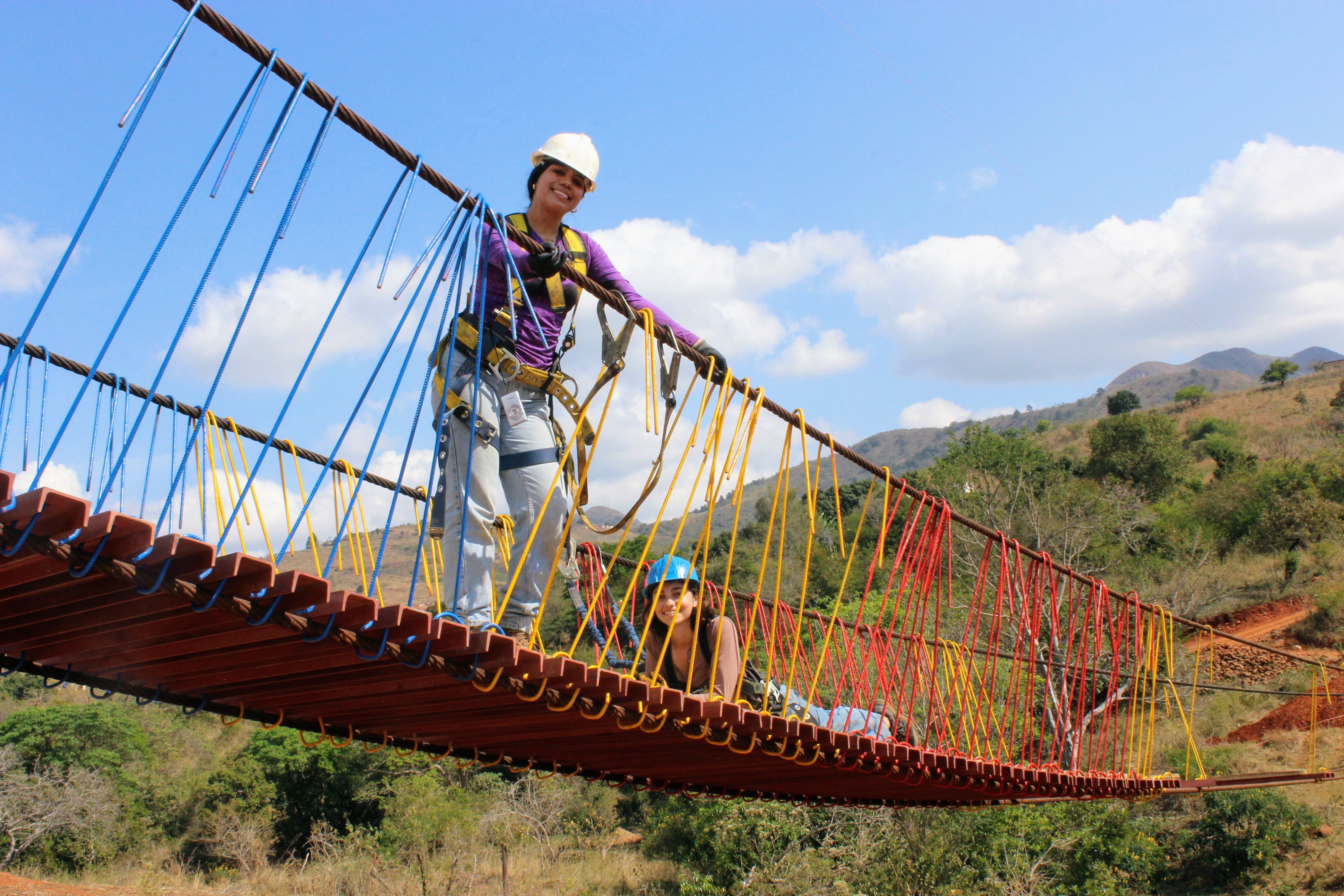 USI engineering students stand on the suspension bridge the built as part of Engineers in Action