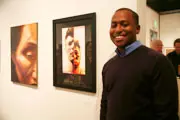 DeWayne Esson, senior graphic design student, with his work