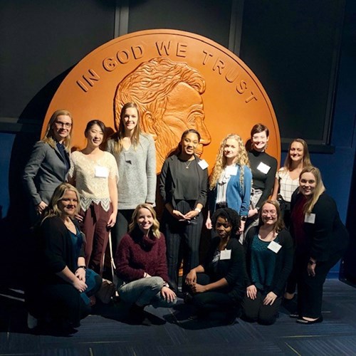 Students in front of a giant penny