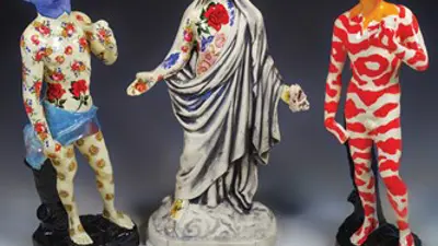 Exhibition poster featuring three ceramics figures