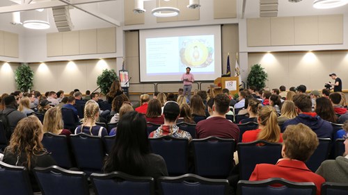 Newman presenting in Carter Hall