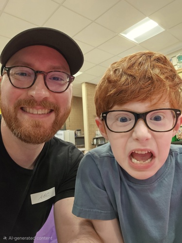 Dr. Schaefer with his son smiling at camera
