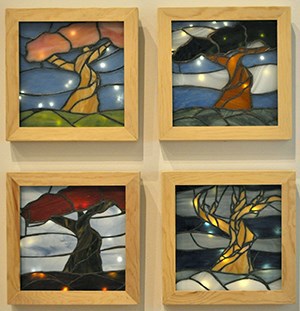 Lighted stained glass panels with trees